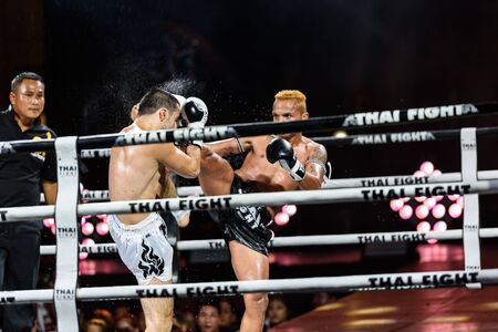 BANGKOK - DECEMBER 24 : Petch-Samui Lukiaoporongtom-Kromsappasamit of Thailand and Albert Amirdzhanyan of Russia in THAI FIGHT 2016 on December 24, 2016 at Central World, Bangkok, Thailand.のeditorial素材
