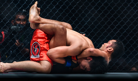 BANGKOK - MARCH 11 : Dejdamrong Sor Amnuaysirichoke of Thailand and Joshua Pacio of Philippines in One Championship "One : Warrior Kingdom" on March 11, 2017 at Impact Arena, Muang Thong Thani, Bangkok, Thailandのeditorial素材