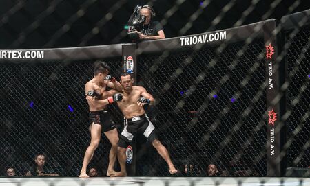 BANGKOK - December 09 : Deadly Star Sagetdao Petpayathai of Thailand and Jimmy The Silencer Yabo of Philippines in One Championship Warrior of The World on December 09, 2017 at Impact Arena, Muang Thong Thani, Bangkok, Thailandのeditorial素材