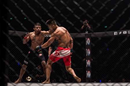 BANGKOK - March 24 : Bibiano Fernandes of Brazil and Martin Nguyen of Australia in One Championship : IRON WILL on March 24, 2018 at Impact Arena, Muang Thong Thani, Bangkok, Thailand.のeditorial素材