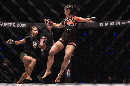 BANGKOK - March 24 : Angelie Sabanal of Philippines and Rika Ishige of Thailand in One Championship : IRON WILL on March 24, 2018 at Impact Arena, Muang Thong Thani, Bangkok, Thailand.のeditorial素材