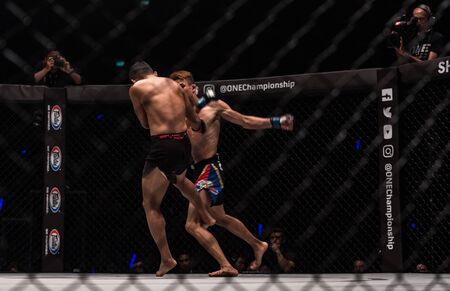 BANGKOK - March 24 : Jeremy Miado of Philippines and Dejdamrong Sor Amnuaysirichoke of Thailand in One Championship : IRON WILL on March 24, 2018 at Impact Arena, Muang Thong Thani, Bangkok, Thailand.のeditorial素材