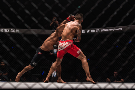 BANGKOK - March 24 : Bibiano Fernandes of Brazil and Martin Nguyen of Australia in One Championship : IRON WILL on March 24, 2018 at Impact Arena, Muang Thong Thani, Bangkok, Thailand.のeditorial素材
