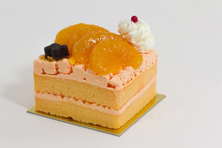 Orange cake decorate with freshcream and butterfly cacao.の写真素材