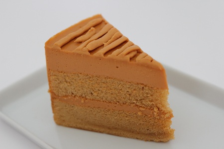 Thai tea layer cake on white backgroundの写真素材