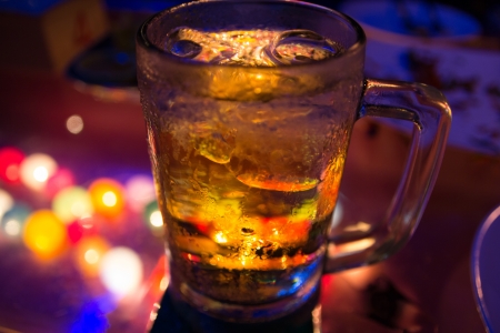 Glass of beer with night sceneの写真素材