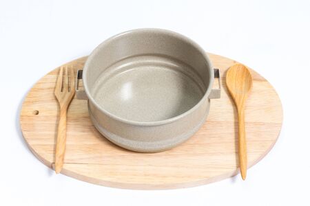 empty tiffin with wooden spoon fork on wood isolated on with backgroundの写真素材