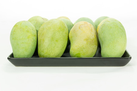 Green mango isolated on white backgroundの写真素材