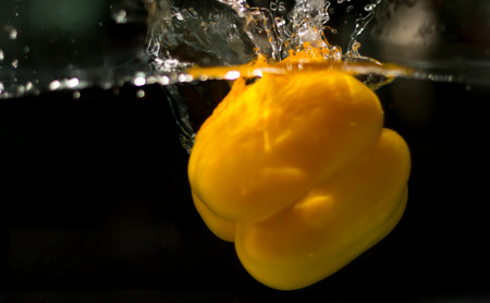 bell pepper drop in the waterの写真素材