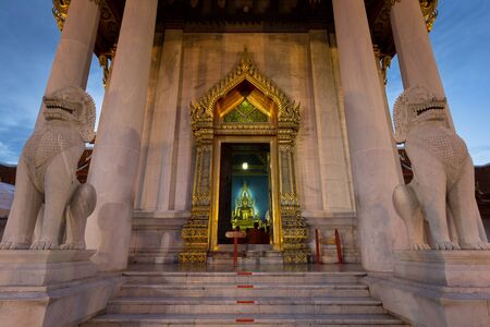 Bangkok,Thailand-July 31,2015:Buddhist monk pray in the evening at  Marble Temple, Wat Benchamabopit Dusitvanaram in Bangkok, Thailandのeditorial素材