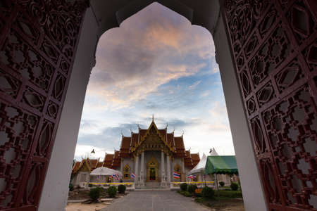 Bangkok,Thailand-July 31,2015:Buddhist monk pray in the evening at  Marble Temple, Wat Benchamabopit Dusitvanaram in Bangkok, Thailandのeditorial素材