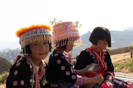 CHIANG MAI, THAILAND - FEB 21,2015 : Portrait of unidentified hill tribe children playing with friend with traditional clothes in her village  in Chiang Mai, Thailand.のeditorial素材