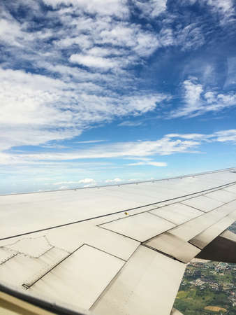 Wing of an airplane flying in the sky