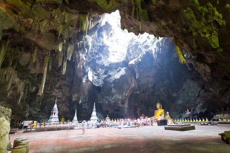 Temple in a cave. Khao Luang cave in Phetchaburi, Thailandの写真素材