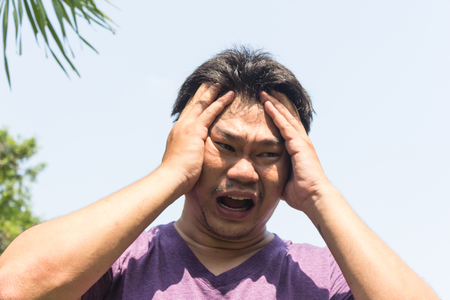 A man are heat stroke on the sunの写真素材