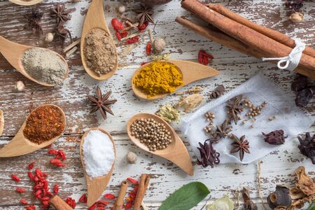 Herbs and spices on wood backgroundの写真素材