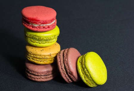 Close up macaroons on black background