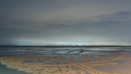sandy beach in low tide in the night