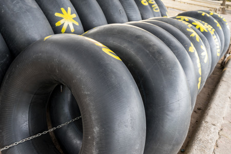 Group of black inflatable ring at the beach in Thailandの写真素材