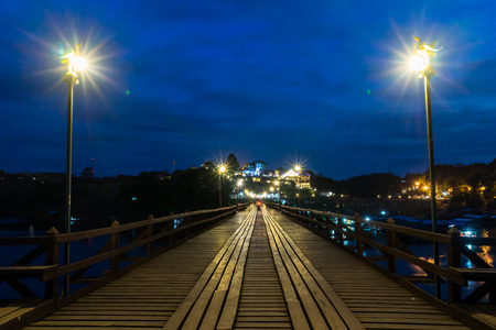 Wooded bridge Saphan Mon (Mon Bridge) at night in Sangkhlaburi District, Kanchanaburi, Thailand.の写真素材