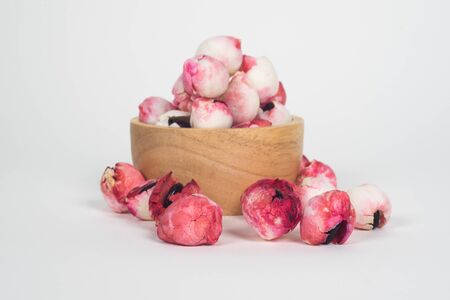 Manila Tamarind fruit in wood bowl with white backgroundの写真素材