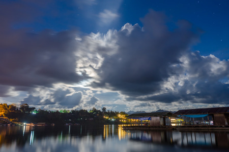 Floating village at night, view from the bridge  in Sangkhlaburi District, Kanchanaburi, Thailand. の写真素材