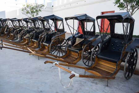 ancient rickshaw parking on the roadの写真素材