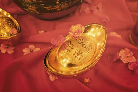 Chinese new year decoration traditional with gold ingotsの写真素材