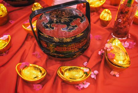 Chinese new year decoration traditional with gold ingotsの写真素材