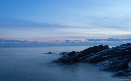 rock on the beach with sky at samila beach, Thailandの写真素材