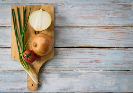 Fresh Tomatoes, Onion and Parsley on wood backgroundの写真素材