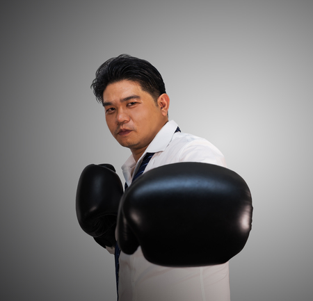 Business man with boxing gloves の写真素材