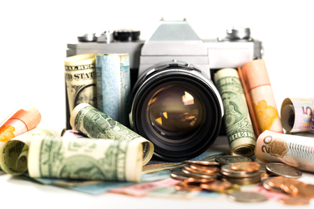 close up money cash and coins with camera on white background の写真素材