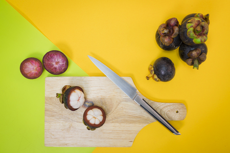 mangosteen on yellow and green backgroundの写真素材