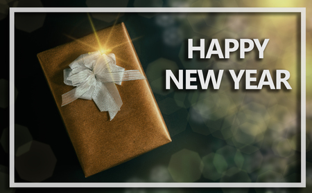 gift box on dark background with happy new year text