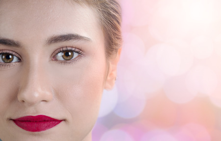 Close up beautiful woman face on blur backgroundの写真素材