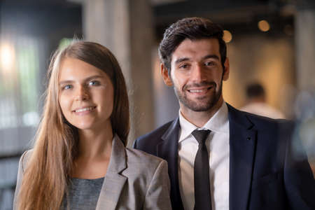 Close up of portrait business man and woman in suit smile.の写真素材