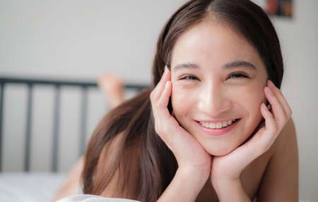 Asian woman with bikini posing in a home environmentの写真素材