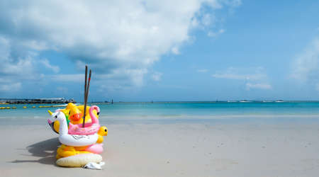 Life ring on the beach background
