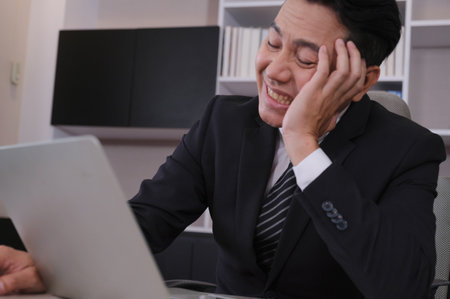 Businessman stressed from work was scolded by the participants not working wellの写真素材