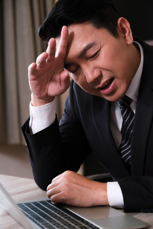 Businessman stressed from work was scolded by the participants not working wellの写真素材