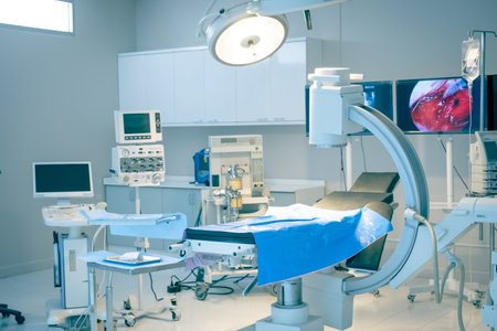 Empty operating room with bed and medical equipped in a hospitalの写真素材