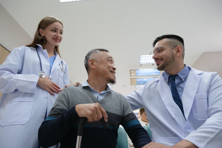 Doctor examination and giving hope with elderly patient in the nursing hospital.の写真素材