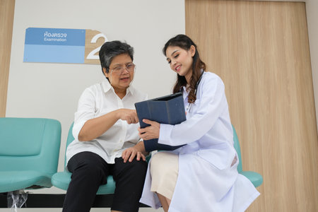 Doctor examination and giving hope with elderly patient in the nursing hospital.の写真素材
