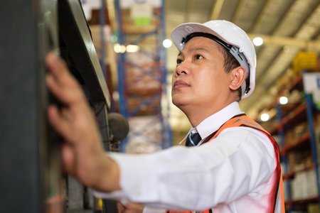 Group of Industrial worker working at warehose factory.