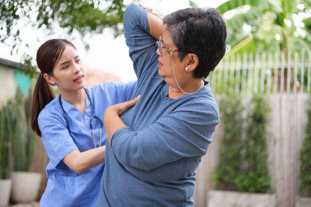 Doctor examination and giving hope with elderly patient at home. Nurse caring for the elderly at homeの写真素材