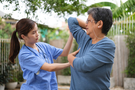Doctor examination and giving hope with elderly patient at home. Nurse caring for the elderly at homeの写真素材