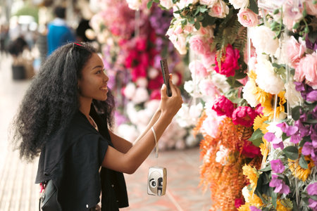 Asian woman enjoy travel in  downtown district and she taking a photo and using mobile live on...