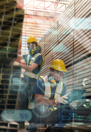 Team of engineers with safety suits and helmet working at the factoryの写真素材