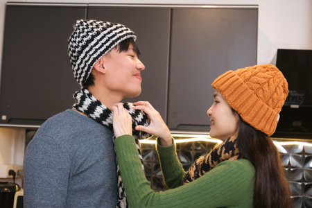 Young Asian couple living at home in winter seasonの写真素材